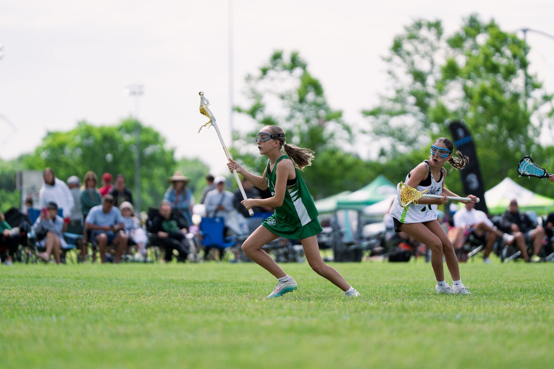 Dublin Lacrosse Club player carrying the ball during a summer tournament