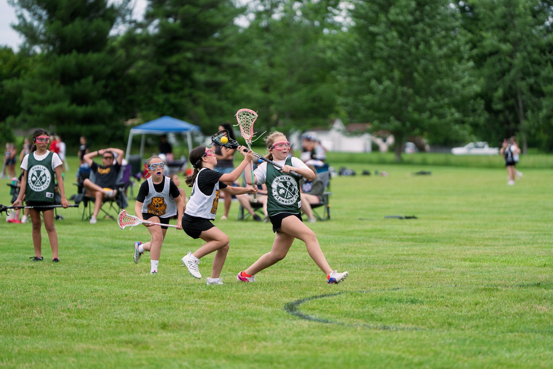 Dublin Lacrosse Club player attacking in open field